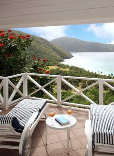 Catch a breeze on the Seaview Cottage's private terrace with views of the Caribbean.