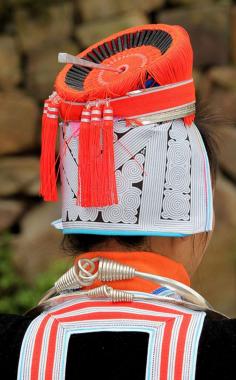
                    
                        China | Details of a woman's headdress.  From the Guizhou + Guangxi album | ©Rudi Roels
                    
                