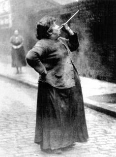 
                    
                        "A forgotten profession: In the days before alarm clocks were widely affordable, people like Mary Smith of Brenton Street were employed to rouse sleeping people in the early hours of the morning. They were commonly known as ‘knocker-ups’ or ‘knocker-uppers.' Mrs. Smith was paid sixpence a week to shoot dried peas at market workers’ windows in Limehouse Fields, London." • photo: Philip Davies’ Lost London: 1870-1945
                    
                