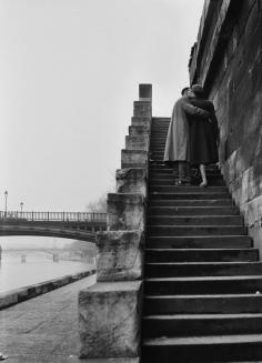 
                    
                        A courting couple kissing on the steps on the bank of the river, 1954
                    
                