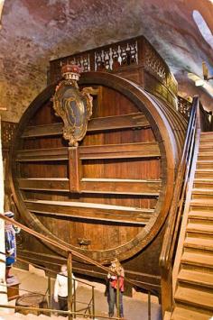 
                    
                        Heidelberg Castle’s Haunted Wine Barrel. The world's largest wine cask, the Heidelberg Tun was built in 1751 from the trunks of 130 oak trees and has a capacity of 58,124 gallons. It is 28 feet deep by 23 feet high. The balustraded platform on top was built as a dance floor.
                    
                