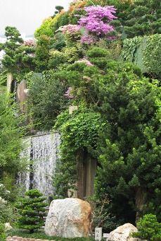 
                    
                        A manmade waterfall and a rock garden in Nan Lian Garden, Hong Kong
                    
                