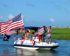 
                    
                        Best American Beach Towns for Fourth of July: Fourth of July boat parade in Murrells Inlet, South Carolina. Coastalliving.com
                    
                