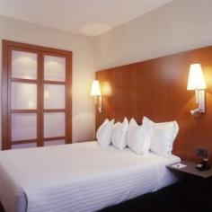 This modern hotel is located on the outskirts of Granada, right next to the bus station, offering easy access to the city centre, which is about a 20-minute drive away. The establishment is an ideal base for those seeking to explore the city and its surroundings as well as a comfortable accommodation for any business journey. Modern guest rooms await travellers to offer a fully comfortable stay, where they can relax and feel at ease after a long day out. Standard facilities include Wi-Fi access, minibar and a satellite TV. The on-site restaurant proposes affordable set menus, offering delicious and healthy cuisine. The property offers a spacious and modern meeting room, ideal to celebrate great conferences or special events. After a busy day of work, guests may practice some exercises at the hotel's fitness centre or enjoy a relaxing moment with the traditional Hammam.