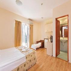 This apartment hotel is located next to one of the most beautiful beaches on the Bulgarian Black Sea Coast, Kavazite Beach, 3km from the historical town of Sozopol, where guests can find nightspots and links to the public transport network. The setting of the hotel is away from discos or bars, thus bringing silence to your holidays. Attractions in the surrounding area include the Old Town of Sozopol and the Appolognia Necropolis (3km), the Ropotamo reserve (13km) and Primorsko Aqua Park (16km). Bourgas Airport is 50km away and there are 200km to Varna Airport. This new apartment hotel is an oasis of calmness and pleasure and combines the joy of a holiday by the seaside with the beauty of nature. The hotel is situated on a hill with great panoramic views of the whole bay and comprises a total of 90 comfortably furnished studios and apartments. Facilities available to guests at this air-conditioned establishment include a lobby area, a games room, a children's playground, bar and restaurant, outdoor pool, fitness. Guests can also take advantage of the LAN Internet access and laundry service. There is parking area available for those arriving by car. Beach shuttle service is available too. All studios and apartments come with a private bathroom with a shower cubicle and a hairdryer and offer twin beds or a king-size bed. They have a fully equipped kitchenette with a minibar and tea and coffee making facilities and the living and sleeping room in the apartments are separated by a connecting door. All are equipped with a direct dial telephone, cable TV, Internet access and a safe. Furthermore, individually regulated air conditioning units are provided in all accommodation as standard and they feature a balcony with a table and chair. There are extra beds for bigger families with kids. The hotel has solar installation for hot water thus reducing its carbon footprint and stays in tone with the surrounding greenery and nature.