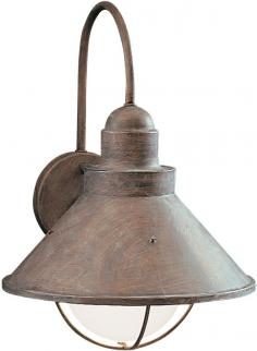 Traditional-style wall light. Aluminum construction in a variety of finishes. Conical metal shade in stainless steel. Accommodates (1) 150W medium base bulb (not included). Overall dimensions: 10.25 diam. x 14.25H inches. A country style lighting fixture, the Kichler Seaside 9023 Outdoor Wall Lantern - 10.25 in. is beautiful. Ideal for lodge or traditional home decors, it's available in a series of attractive finishes. You can choose the finish that blends well with your outdoor color theme. Apart from doorway, you can even use it to enhance the ambience of your entryway, porch or terrace. Featuring sturdy combination of aluminum and steel, it's built to last for many years. Kichler QualitySince 1938, Cleveland-based Kichler Lighting has been known for their innovative designs and excellent craftsmanship. Kichler is the world's leading decorative lighting fixture company and the winner of four ARTS Lighting Manufacturer of the Year awards. Kichler designers travel the world to discover the latest trends in exterior and interior style, colors, and designs. They then translate the best of those trends into fixtures that will bring beauty, pleasure, and light into your home. Kichler fixtures stand the test of time and are functional works of art that you're sure to treasure. Color: Olde Brick.