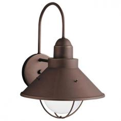 Traditional-style wall light. Aluminum construction in a variety of finishes. Conical metal shade in stainless steel. Accommodates (1) 150W medium base bulb (not included). Overall dimensions: 10.25 diam. x 14.25H inches. A country style lighting fixture, the Kichler Seaside 9023 Outdoor Wall Lantern - 10.25 in. is beautiful. Ideal for lodge or traditional home decors, it's available in a series of attractive finishes. You can choose the finish that blends well with your outdoor color theme. Apart from doorway, you can even use it to enhance the ambience of your entryway, porch or terrace. Featuring sturdy combination of aluminum and steel, it's built to last for many years. Kichler QualitySince 1938, Cleveland-based Kichler Lighting has been known for their innovative designs and excellent craftsmanship. Kichler is the world's leading decorative lighting fixture company and the winner of four ARTS Lighting Manufacturer of the Year awards. Kichler designers travel the world to discover the latest trends in exterior and interior style, colors, and designs. They then translate the best of those trends into fixtures that will bring beauty, pleasure, and light into your home. Kichler fixtures stand the test of time and are functional works of art that you're sure to treasure. Color: Olde Bronze.