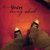 'UNDER', the fourth and NEW Kenny Schick/Basement3 CD, is the heart-felt sound track of an amazingly extraordinary, romantic and life changing adventure in Australia. For Kenny, the last couple years of a long and diverse musical career have been all about bold reassessments of self, a redefinition of his sound, and the decision to take his very personal 'studio project', Basement 3, into the 'live' realm. Inspired by the soulful, naked approach of acoustic musicians such as Gillian Welch, Iron and Wine, and Nick Drake, Kenny made the brave move to take a decade long method of dense, complex orchestration and turn it upon it's head. The result of this seemingly contradictory musical approach, this 'stripping down', yields a product that is very accessible to a wide range of audiences and reveals Kenny's skill as a front man. In keeping with his journey of extreme changes and opposites, his quirky irreverent sense of humor is the perfect ying to the yang of his often dark, introspective music. With the freedom and mobility a solo act affords, and the desire to explore his mind and this new musical direction more deeply, Kenny started to ponder the possibilities of travel. Having had more interest in his artsy music abroad, he entertained the idea of a musical adventure in Europe, but an Australian friend redirected his focus to the southern part of the planet. Having lived his whole life in the San Francisco bay area, Kenny needed a little shove to take this big dive - and it was New Year's Day 2006 that Kenny met an Australian girl named Sabine on myspace.com. After a 7 month online romance, Kenny quit all his bands, his part time job, left family and friends, and set out on a year long adventure down under. The new Kenny Schick/Basement3 CD, 'UNDER', was born on the opposite side of the world. Mostly written and recorded on a laptop in a small apartment in St. Kilda, Victoria, 'UNDER' is an all-acoustic venture. It is naked, exposed, and raw-it both documents and reflects the 'journey' and fulfills the evolution