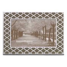 Frame with a modern take on a classic style. Offered in multiple sizes. Enamel-printed pattern based on Moroccan motifs. Vertical or horizontal orientation. Mocha-colored enamel. From snaps of your kids to your high-school reunion to that time you visited Rome, the Reed and Barton Kasbah Mocha Picture Frame is the perfect way to display your fondest memories. This durable frame features a mocha-colored enamel print that's remiscent of a classic, Moroccan lattice pattern. It's offered in a range of sizes, so find the one that works best in your space. About Reed & Barton/Eureka Mfg. Founded in 1824, Reed & Barton enjoys a reputation as one of the country's foremost marketers of fine tableware and giftware. Recognized for design excellence and the highest quality workmanship, Reed & Barton offers an array of exceptional products that satisfy a broad range of tastes. Today the Reed & Barton name graces fine flatware, dinnerware, crystal, giftware, and picture frames, as well as a wide variety of expertly made, handcrafted flatware and jewelry chests. For more than 183 years, our products have been the choice of those with discriminating taste. Our unwavering commitment to quality and customer satisfaction can be found in every product that bears the Reed & Barton name. Attention California Residents - Proposition 65 Warning: Consuming foods or beverages that have been kept or served in leaded crystal products or handling products made of leaded crystal will expose you to lead, a chemical known to the State of California to cause birth defects or other reproductive harm. Note: This vendor provides no warranty per PDA team. 11.14.13. contact info.: customer service department:1-866-797-9675 (8:00 a.m. - 4:30 p.m. EST, Mon. - Fri.). Size: 5 x 7 in.