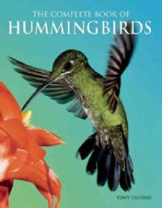 Hummingbird plumage comes in all colors-emerald, ruby, sapphire, azure, garnet and topaz-no wonder they're often called "jewels in flight." These endlessly fascinating little birds have long captured man's imagination with their spectacular beauty and a seemingly magical ability to hover in mid-air. Discover these remarkable little birds in The Complete Book of Hummingbirds by avian expert Tony Tilford. * This is the ultimate reference guide to hummingbirds, featuring a comprehensive overview of the birds' biology, evolution, behavior, breeding, and migration patterns. * Hummingbirds, named for the sound caused by the very fast beating of their wings, have the fastest beat of any bird, approaching 200 beats per second! * You'll be awestruck by the amazing collection of full-color photographs depicting hummingbirds in flight and at rest in the Gallery of Hummingbirds. * Aside from insects, hummingbirds in flight have the highest metabolism of any animal on earth. To survive, they must consume more than 1.5 times their body weight in fluids and nectar daily. That means they must visit hundreds of flowers every single day-no wonder it seems they never rest! * Learn how to attract hungry hummingbirds to your garden! Discover the kinds of plants and flowers that they love to visit and how to create artificial feeding stations by making your own hummingbird food. * From Woodnymphs and Mountain-Gems to Plovercrests and Hillstars, this thorough book describes all of the hummingbirds of the world and also includes a helpful reference section, complete with a glossary, recommended web sites and further reading.