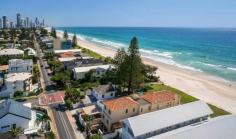 This spectacular Mermaid Beach home has direct beach access and 5 bedrooms; perfect for 2-3 families.